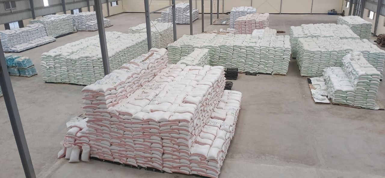 Stacked animal feed bags in JERR PLC warehouse